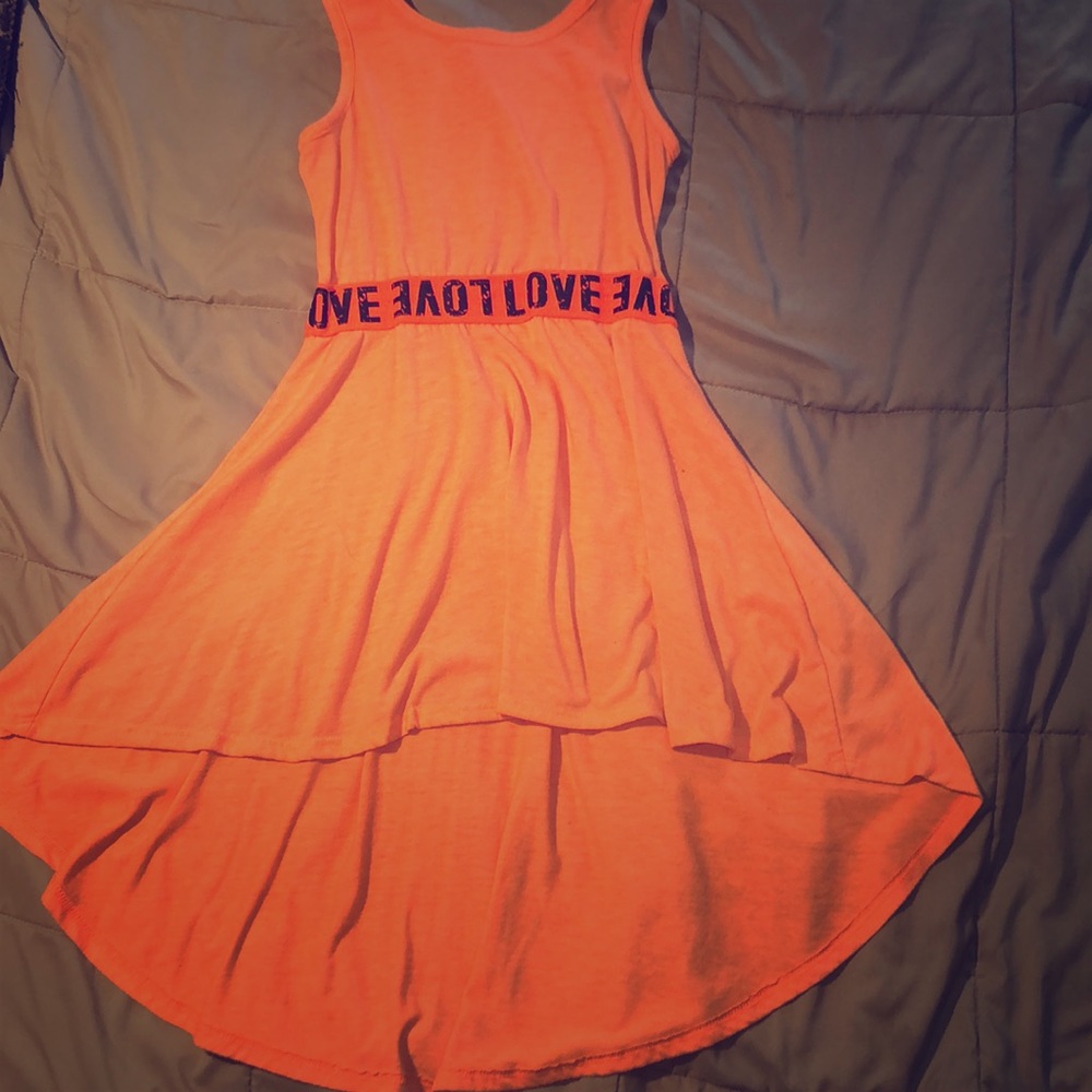 A bright orange dress perfect for summer time!